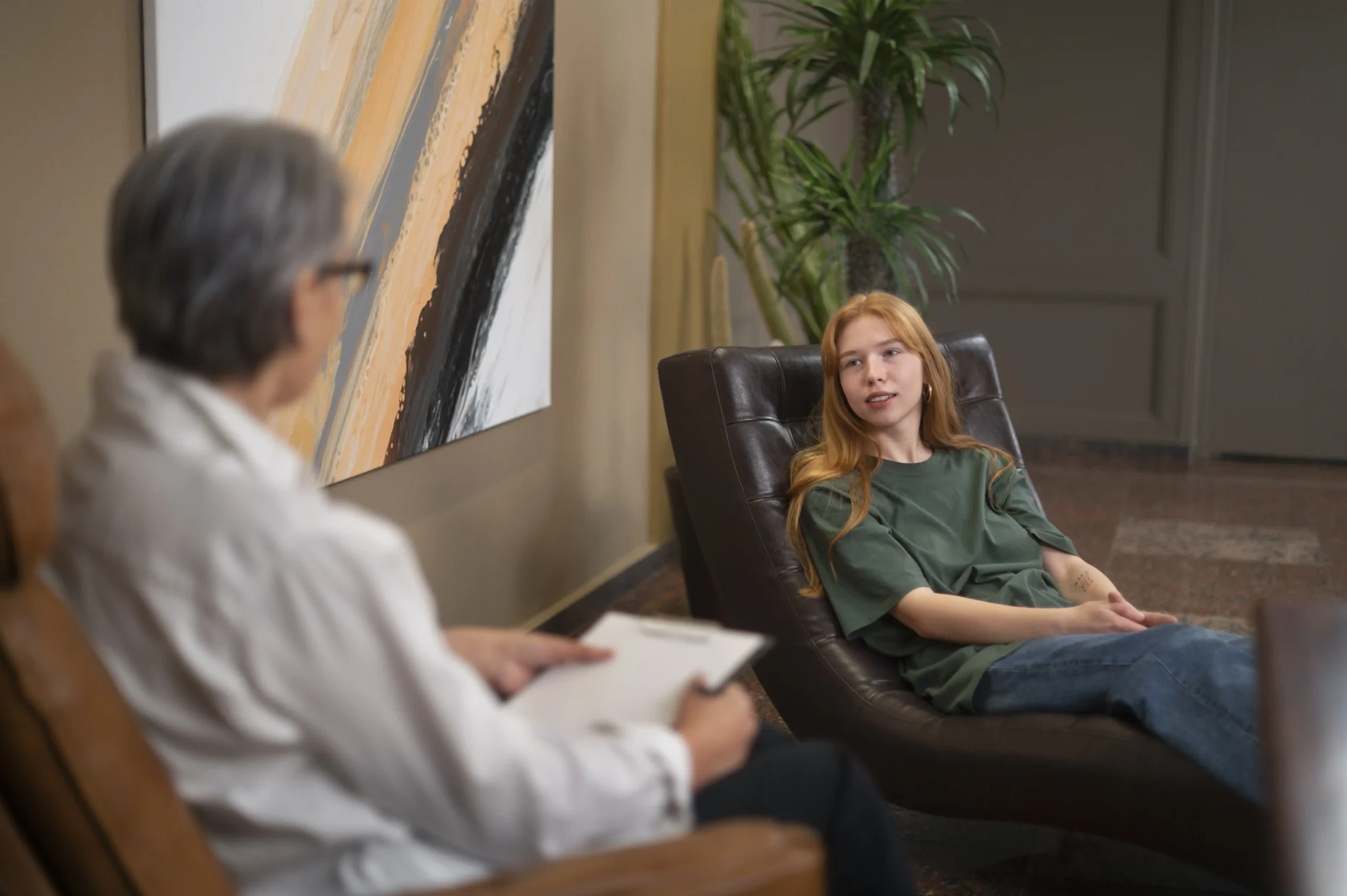 Woman looking thoughtful, in the process of an adult ADHD assessment at Mothermind Psychology