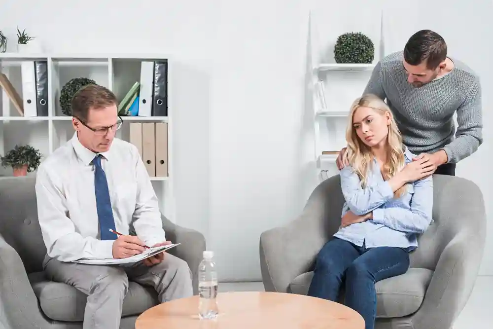 Counselor conducting a psychological evaluation for a couple.