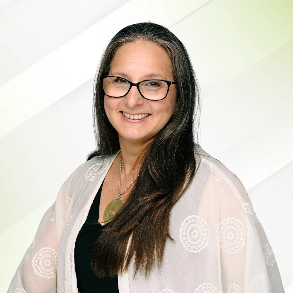 Professional headshot of Christie Rainbeau, counselor at Mother Mind Psychology, offering trauma‑informed therapy.