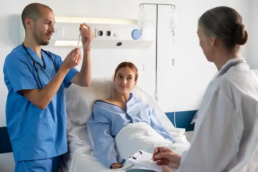 Nurse preparing IV vitamin dose while doctor consults with patient before treatment