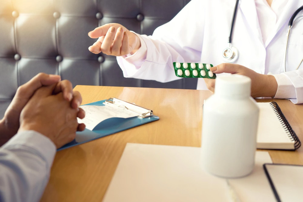 Mothermind Psychology provider presenting prescription medication to a patient during an integrated mental and physical wellness medication management visit in Tampa FL