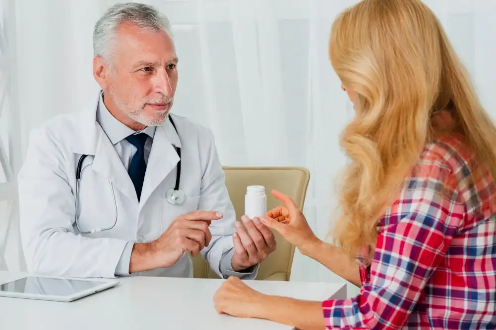 Experienced physician explaining a personalized psychiatric medication plan to a patient during a medication management consultation in Tampa FL